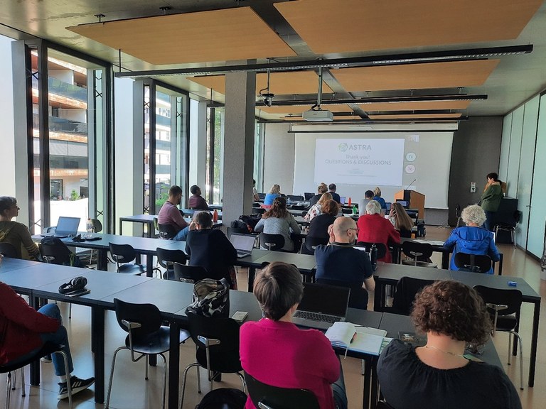 Photo of people listening to a presentation.