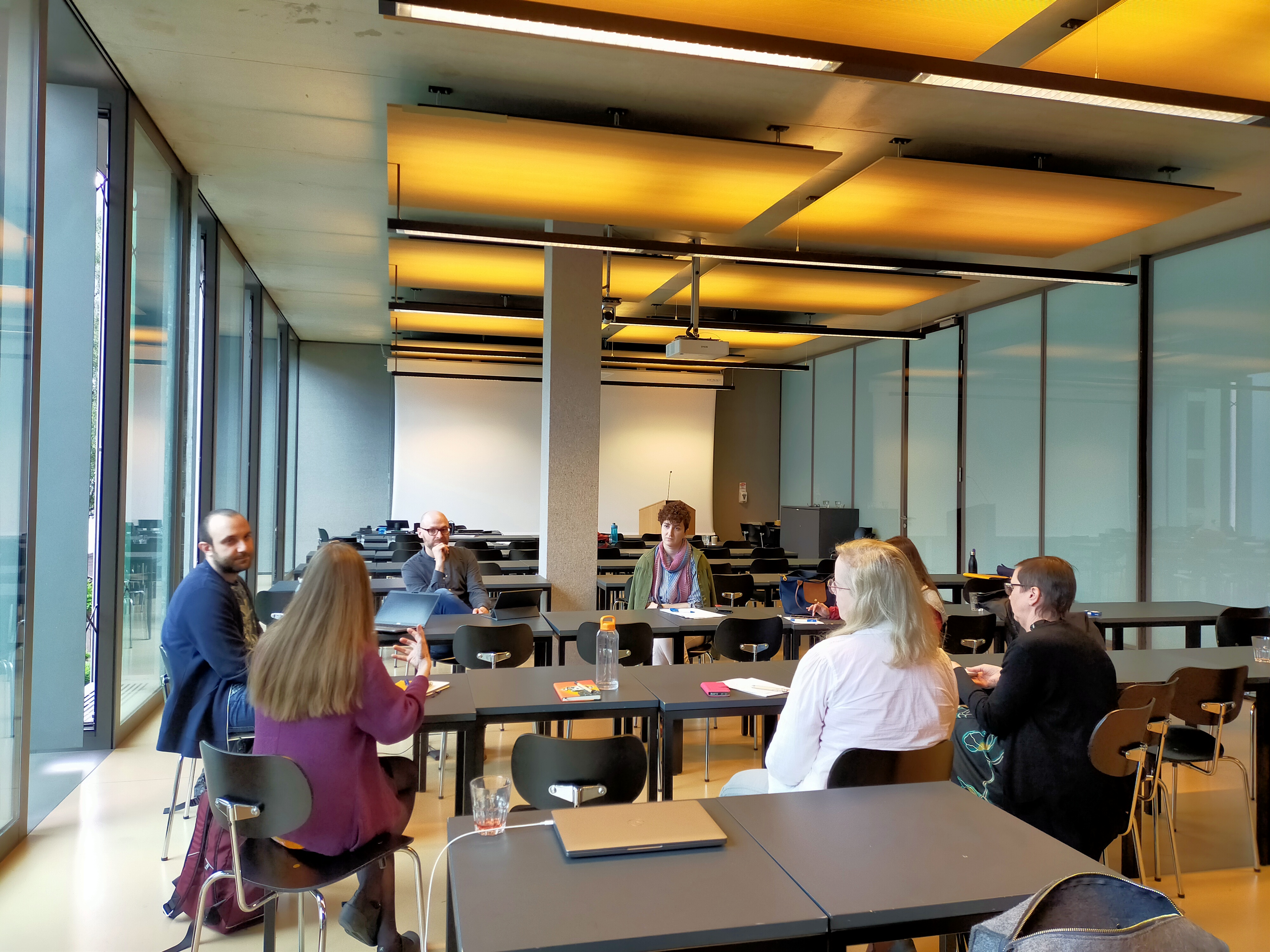 Researchers sitting around a table having a conversation
